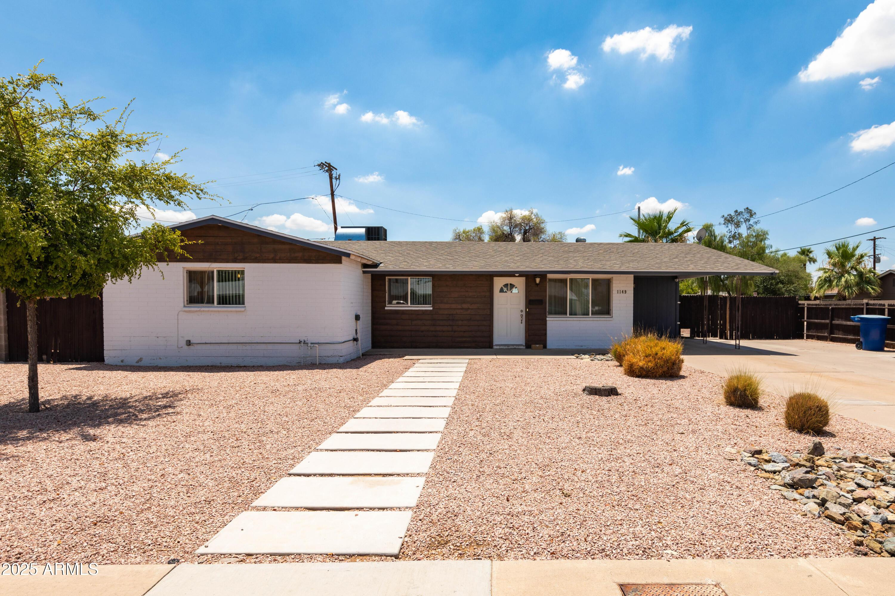 1149 West 10th Street Tempe, AZ 85281 - Photo 1 of 19 a view of a house with a yard and sitting area