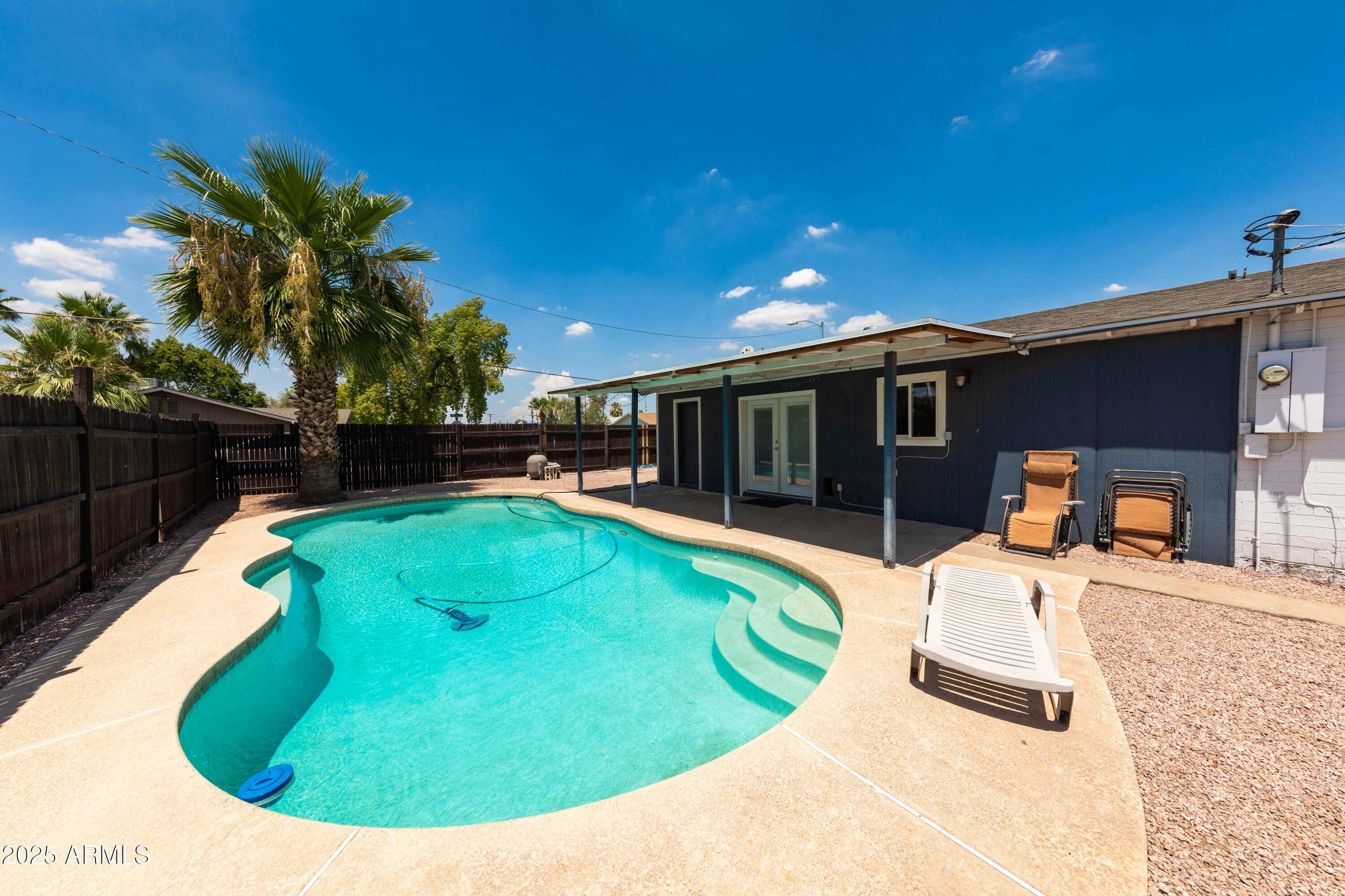 1149 West 10th Street Tempe, AZ 85281 - Photo 2 of 19 a view of a swimming pool with chairs
