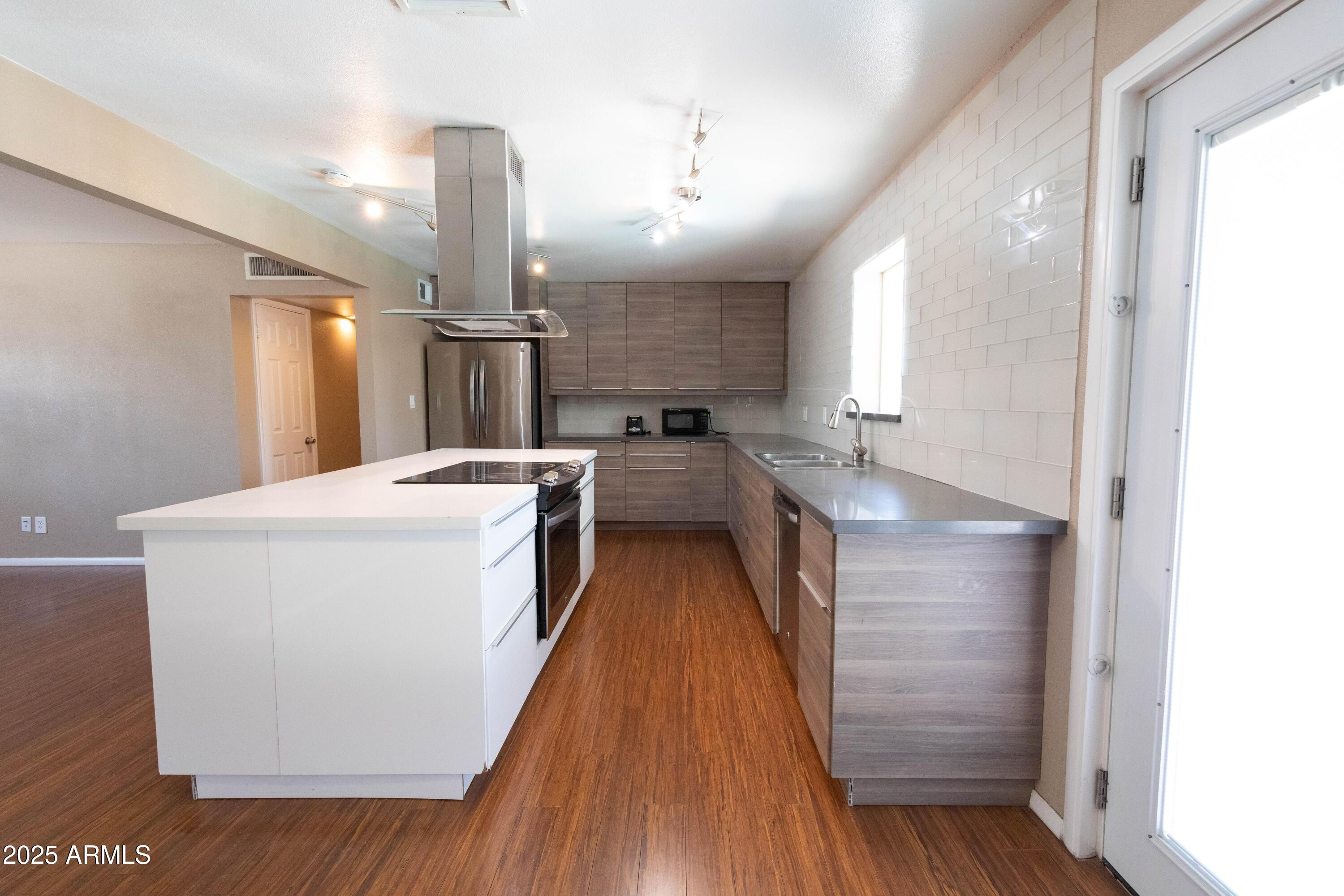 1149 West 10th Street Tempe, AZ 85281 - Photo 6 of 19 a kitchen with a sink and wooden floor