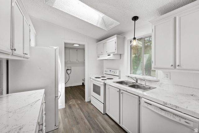 2875 North 400 West, Unit 7 Layton, UT 84041 - Photo 5 of 29 Kitchen featuring white cabinetry, wood-finish flooring, and a skylight