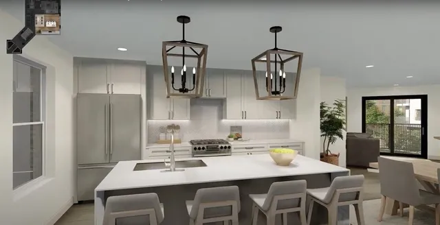 a kitchen with stainless steel appliances a dining table and chairs
