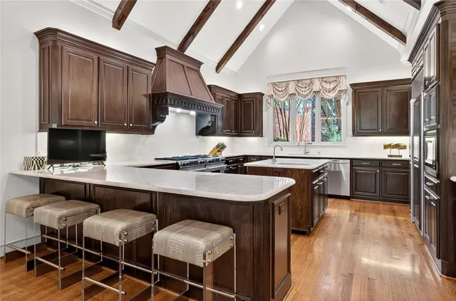 a kitchen with a sink cabinets and window