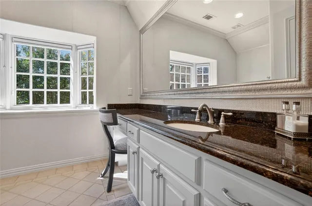 a kitchen that has a sink and a stove