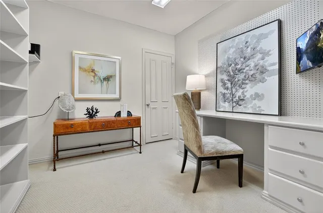 a spacious bedroom with a bed and a window