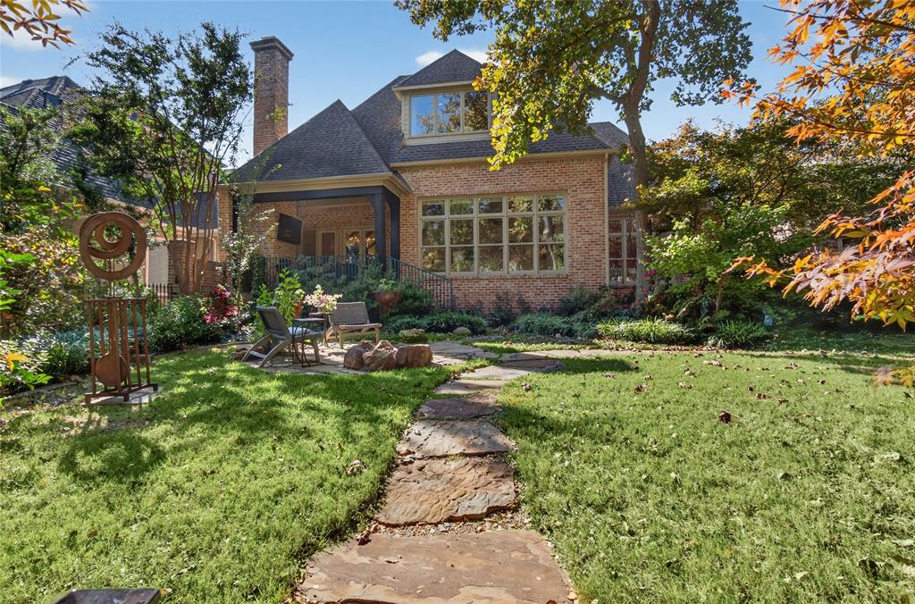 11836 Preston Brook Place Dallas, TX 75230 - Photo 34 of 40 Back of house featuring a patio area, a yard, brick siding, and a chimney