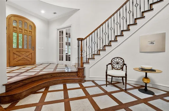 a view of entryway and hall with wooden floor