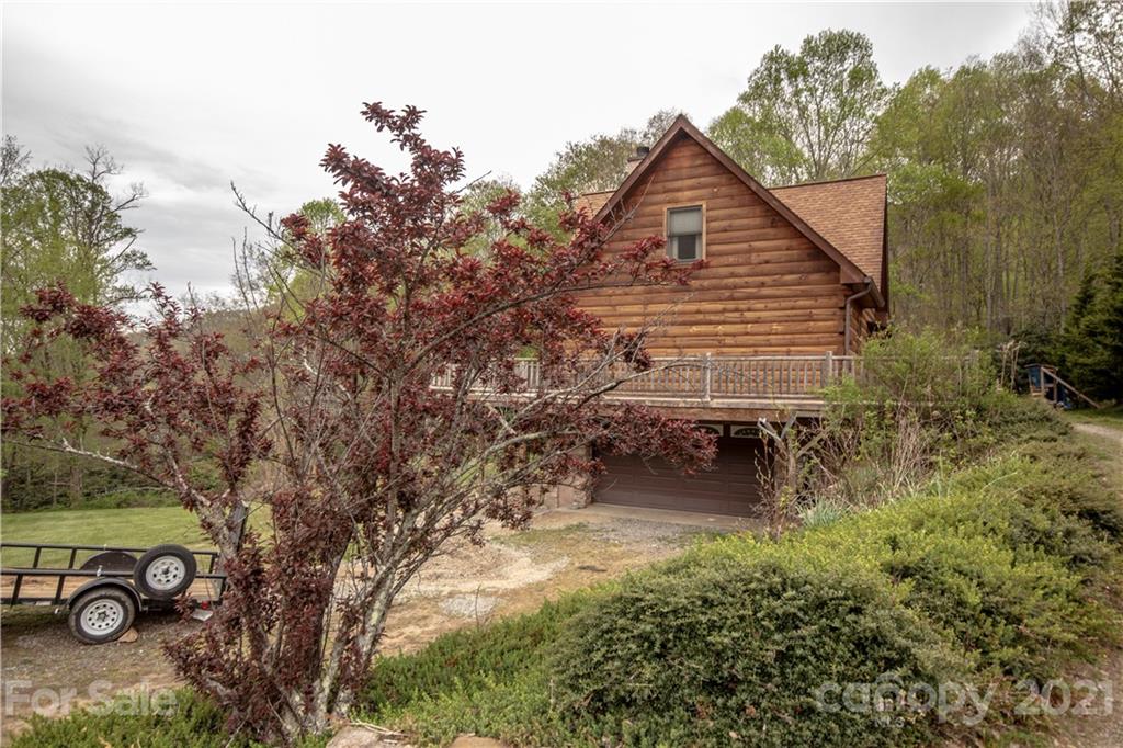 175 Buckeye Branch Drive Clyde, NC 28721 - Photo 2 of 23 a backyard of a house with table and chairs