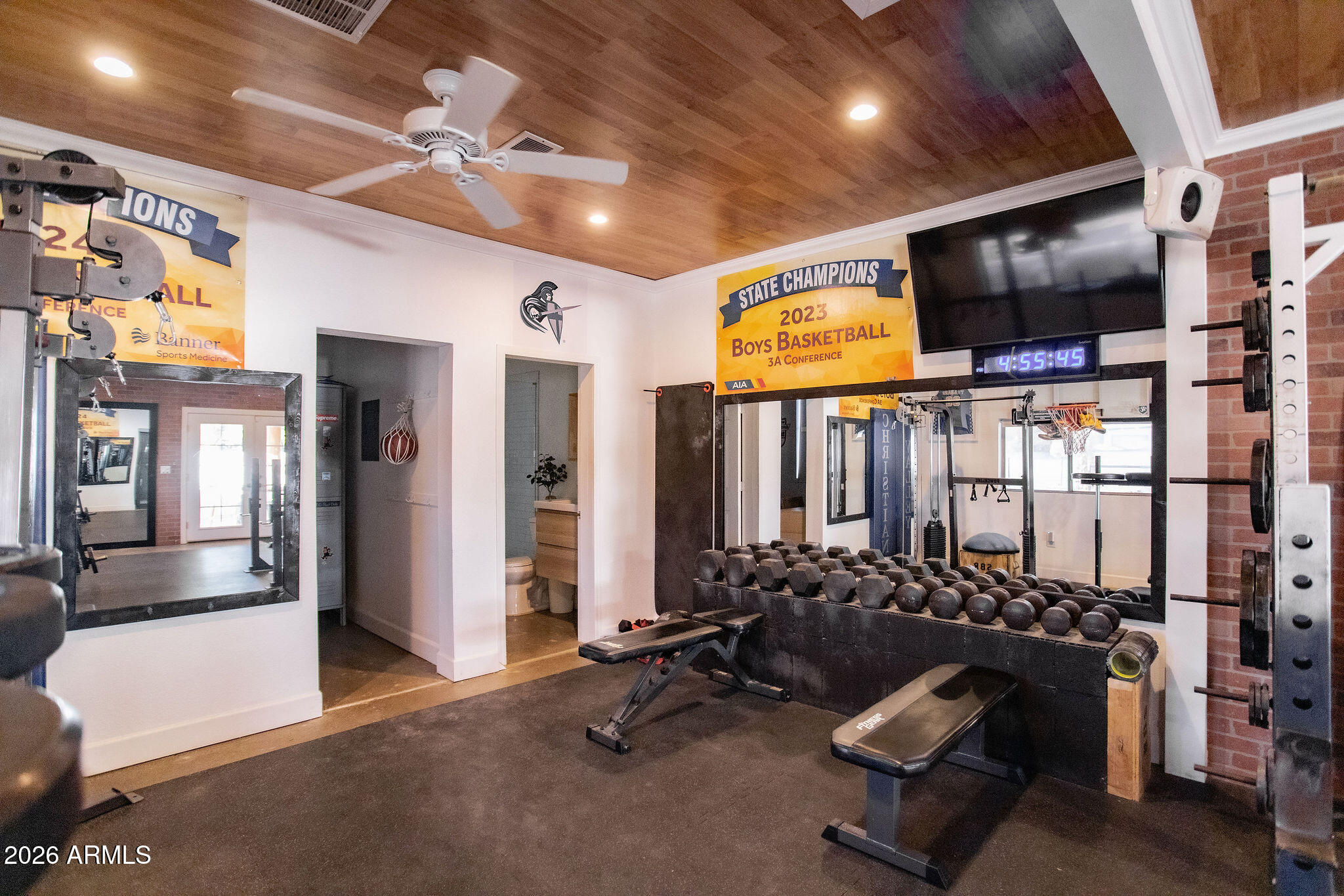 19049 East Cloud Road Queen Creek, AZ 85142 - Photo 48 of 75 a room with gym equipment and a large window