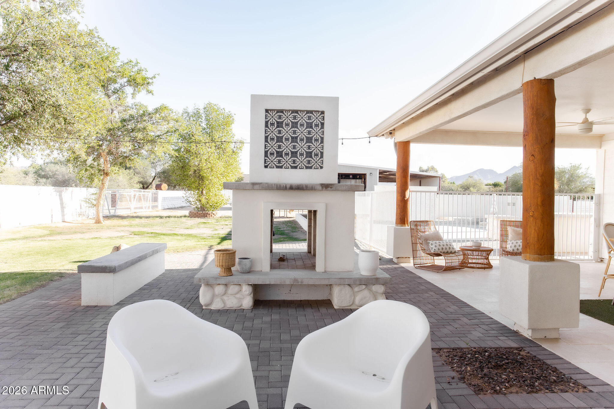 19049 East Cloud Road Queen Creek, AZ 85142 - Photo 59 of 75 a living room with patio furniture and a floor to ceiling window