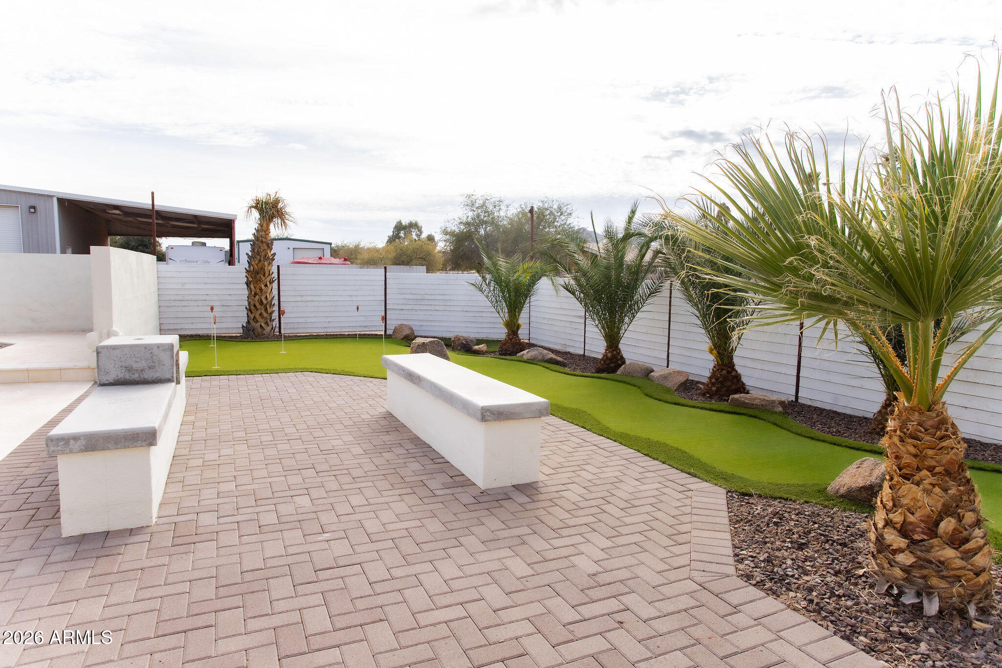 19049 East Cloud Road Queen Creek, AZ 85142 - Photo 60 of 75 a view of a swimming pool with a lounge chairs