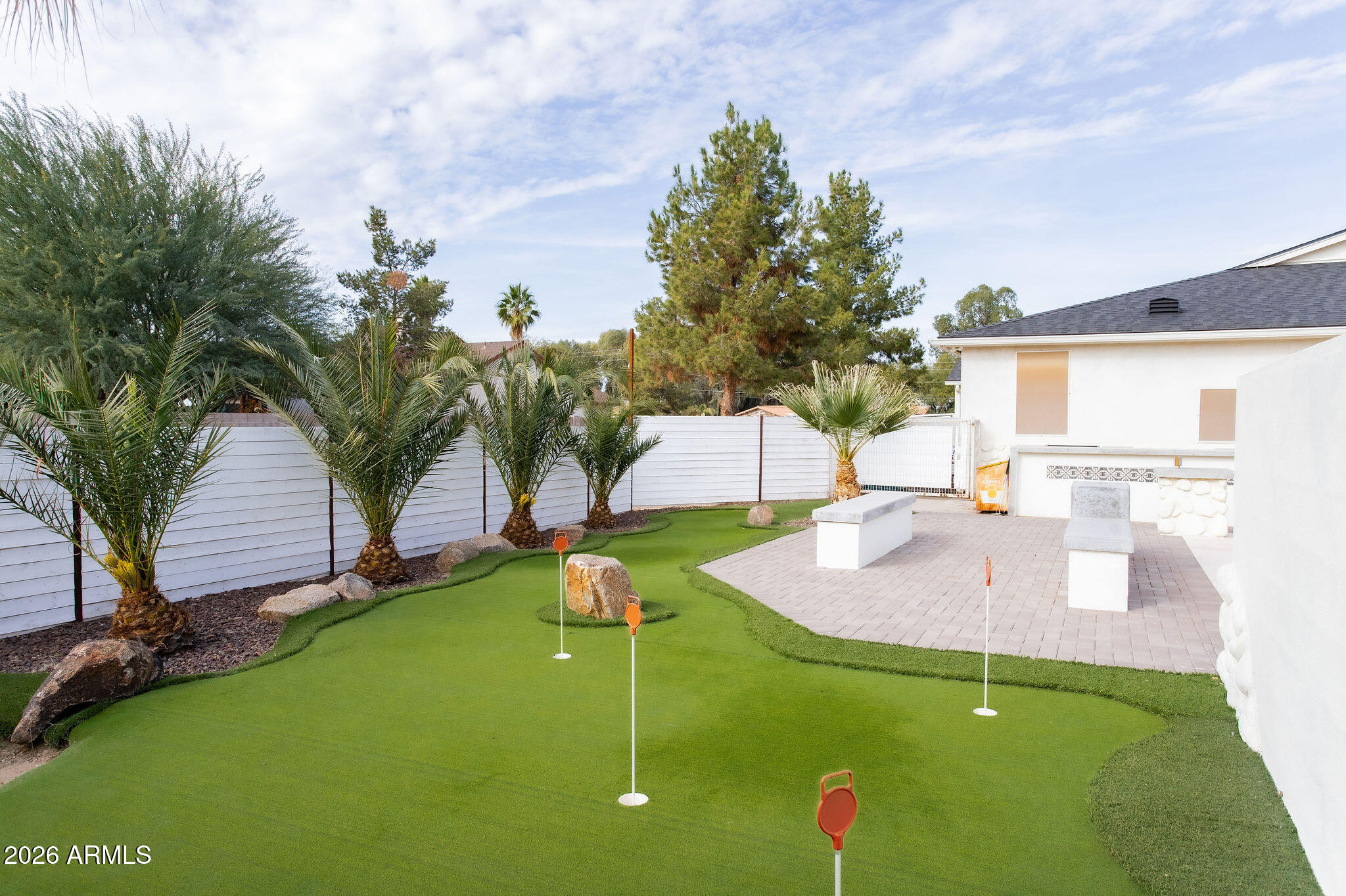19049 East Cloud Road Queen Creek, AZ 85142 - Photo 62 of 75 a backyard of a house with table and chairs