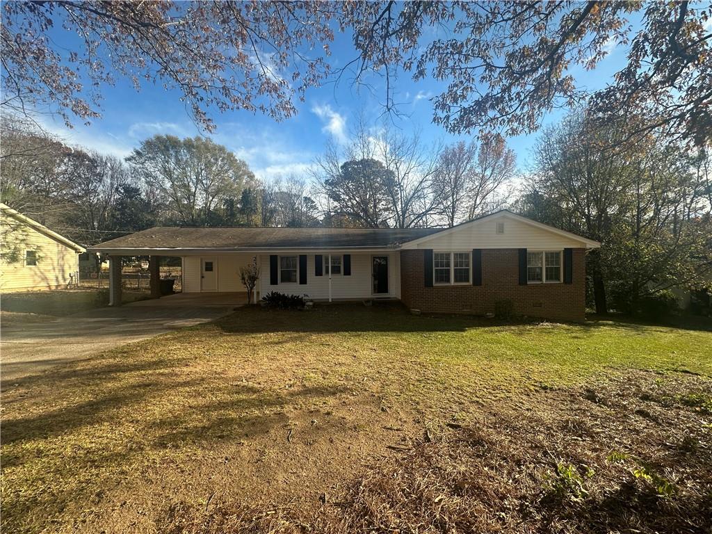 2353 Robin Ridge Drive Southeast Dacula, GA 30019 - Photo 1 of 1 a front view of a house with a yard