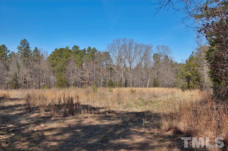 3 Huff Garrett Road Roxboro, NC 27574 - Photo 11 of 21 a view of a lake from a yard