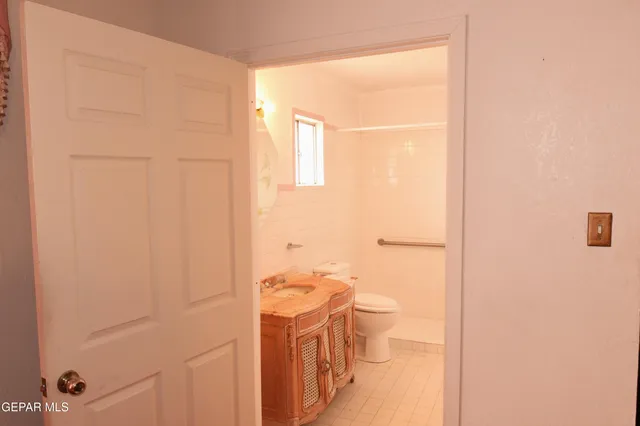 a kitchen with a sink cabinets and window
