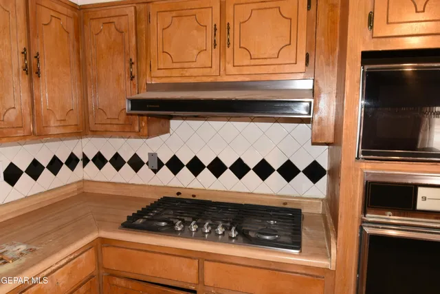 a view of livingroom with furniture wooden floor and windows
