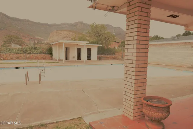 a view of a living room with a floor to ceiling window and floor to ceiling window
