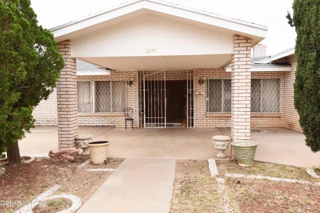 a front view of a house with a outdoor space