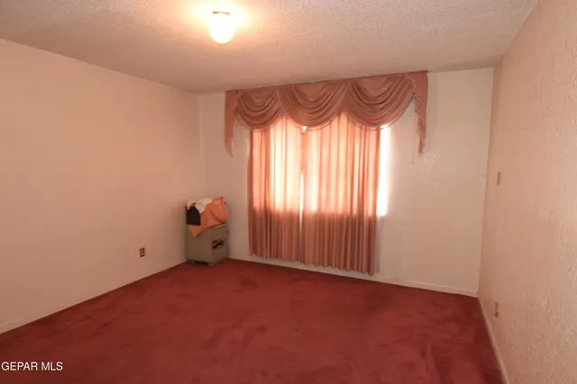 a view of a bathroom from a hallway