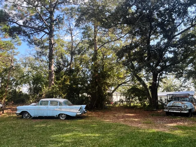 a view of a house with swimming pool and sitting area