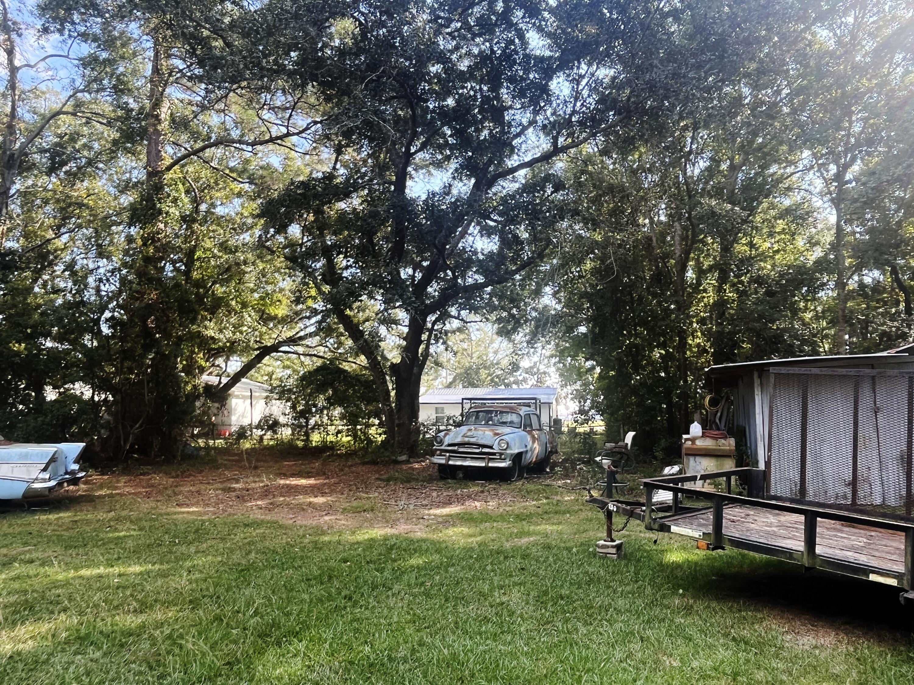 75 Hankins Road Freeport, FL 32439 - Photo 6 of 16 a view of a backyard with sitting area