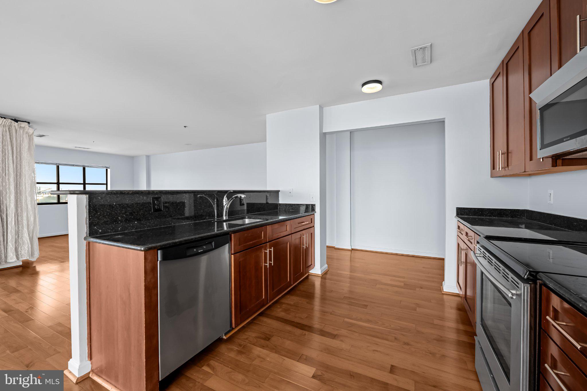 2702 Lighthouse Point East, Unit 738 Baltimore, MD 21224 - Photo 9 of 33 Modern kitchen with sleek finishes.