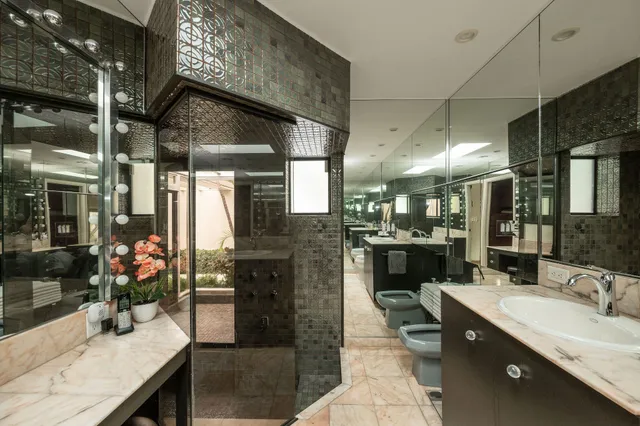 a large kitchen with a stove a sink and a refrigerator