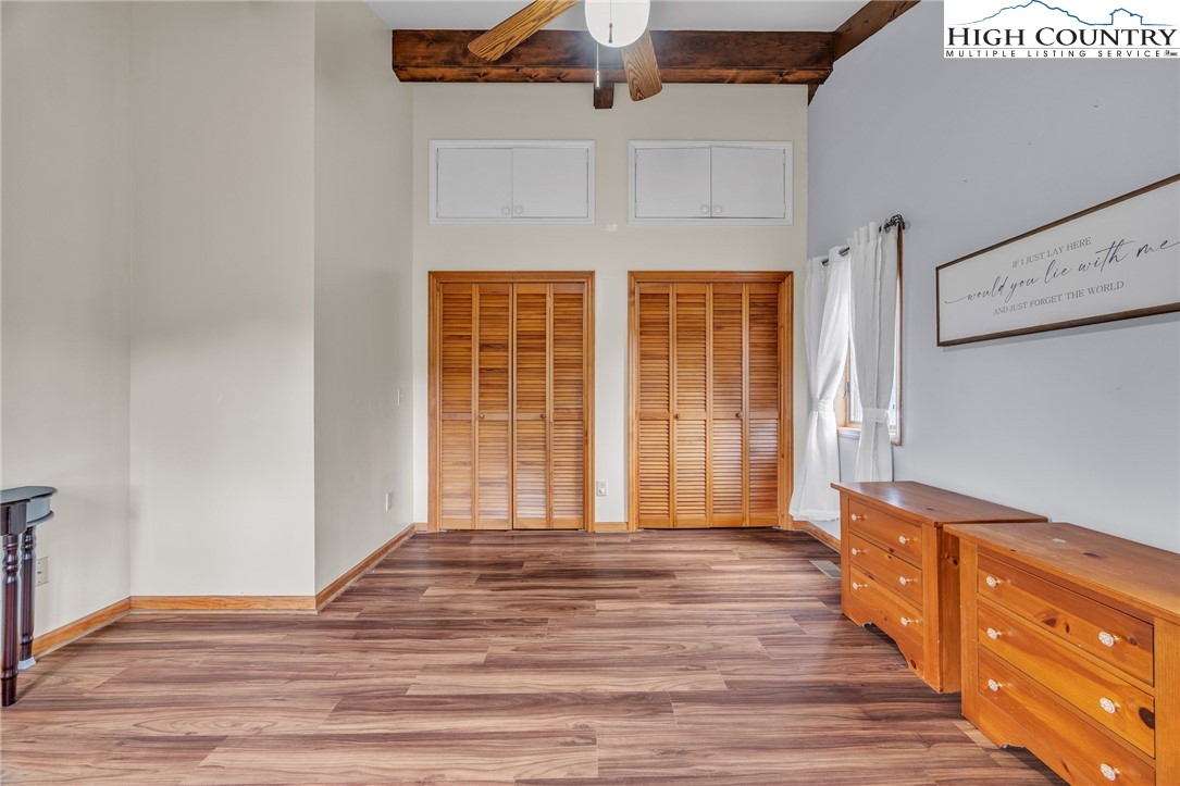 255 Clear View Ridge Crumpler, NC 28617 - Photo 11 of 33 an empty room with wooden floor and windows