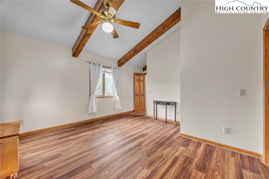255 Clear View Ridge Crumpler, NC 28617 - Photo 12 of 33 a view of empty room with wooden floor and fan