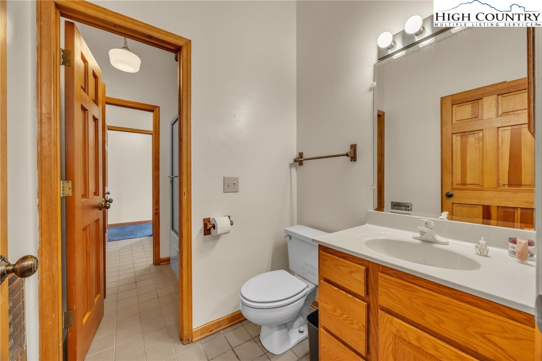 255 Clear View Ridge Crumpler, NC 28617 - Photo 23 of 33 a bathroom with a sink a toilet and shower