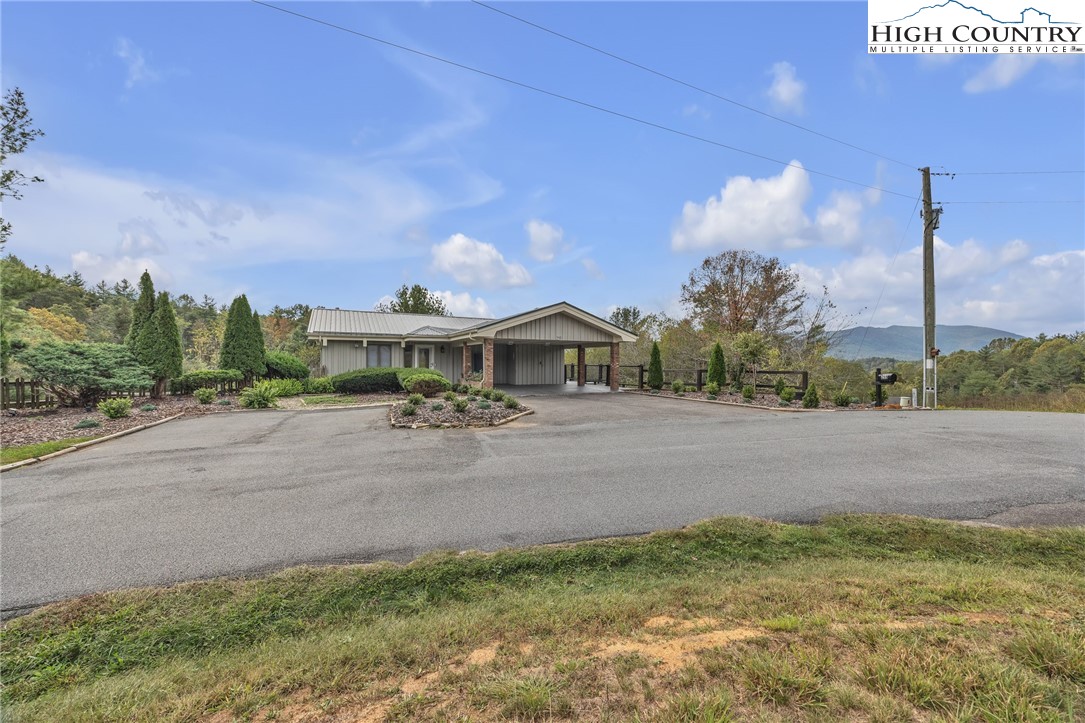 255 Clear View Ridge Crumpler, NC 28617 - Photo 30 of 33 a view of a house with a yard and a street