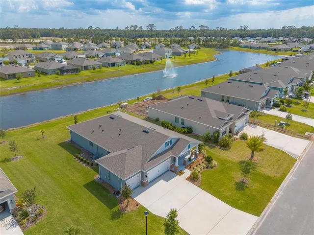an aerial view of a house with a swimming pool