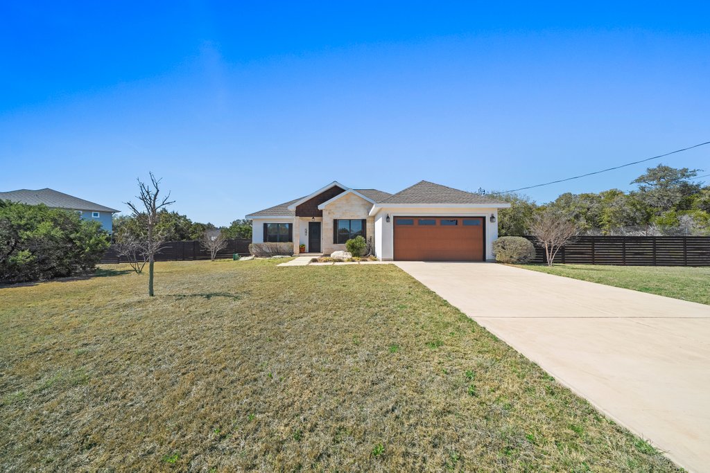 541 Stars And Stripes Fischer, TX 78623 - Photo 2 of 26 Great Curb Appeal! Front yard and beds are sprinklered.