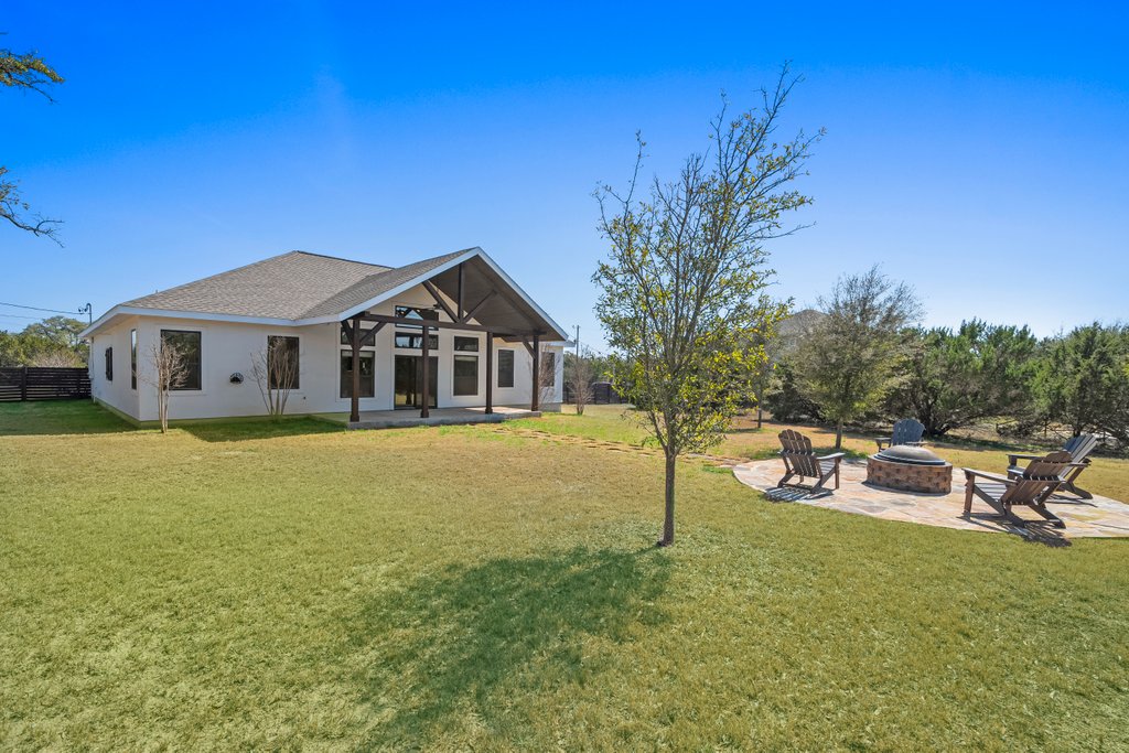 541 Stars And Stripes Fischer, TX 78623 - Photo 24 of 26 Backyard is fenced and sprinklered