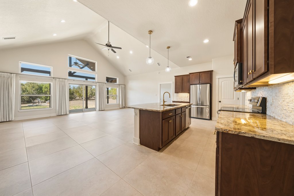 541 Stars And Stripes Fischer, TX 78623 - Photo 25 of 26 Open Floor plan leading out to the covered patio for a great entertainment space.
