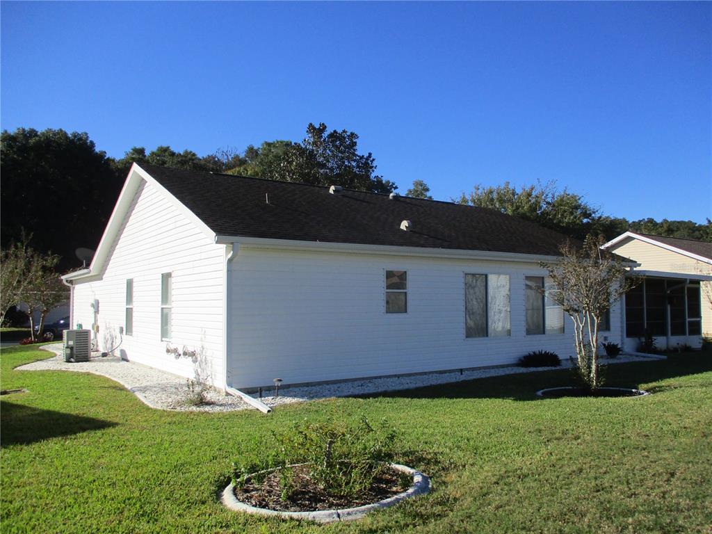11283 Southwest 139th Place Dunnellon, FL 34432 - Photo 58 of 84 a backyard of a house with table and chairs