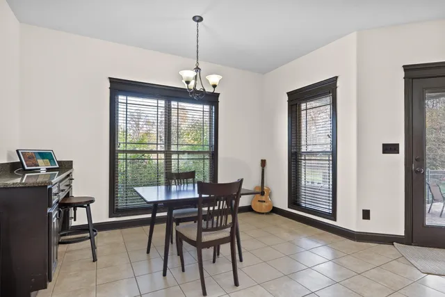 a bathroom with a bathtub and a window