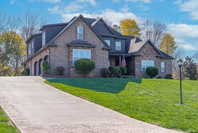 a view of a room with furniture and a window