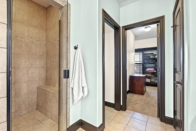 an aerial view of a house with a garden and swimming pool