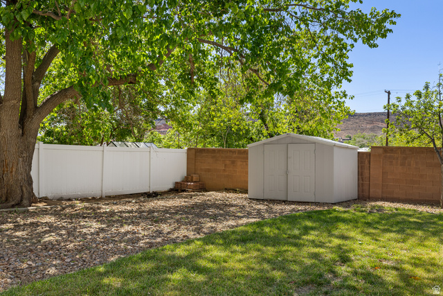 389 North Main Street St. George, UT 84770 - Photo 7 of 44 Fenced backyard with a shed