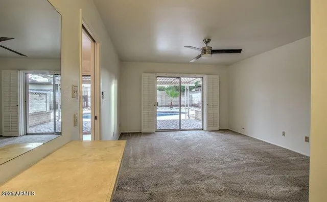 a view of an empty room with a window