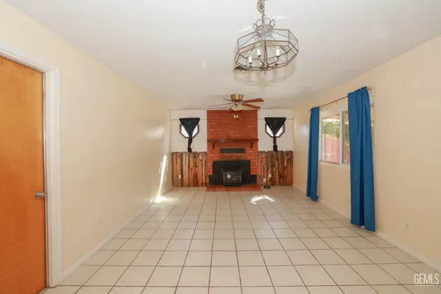 a view of a livingroom with a chandelier furniture and a chandelier