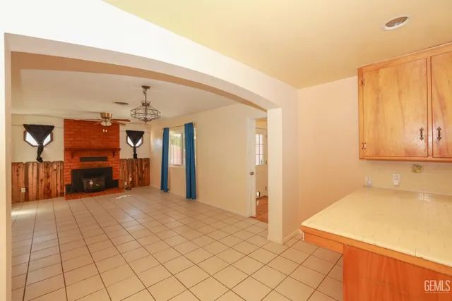 a view of a kitchen with a sink and cabinets