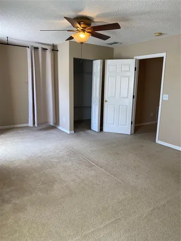 a view of empty room with closet