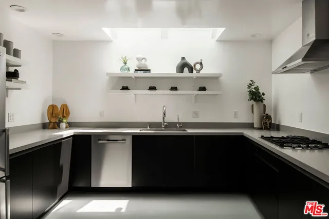 a kitchen with a sink and cabinets