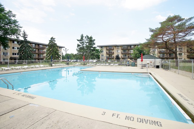 2222 South Goebbert Road, Unit 361 Arlington Heights, IL 60005 - Photo 8 of 10 a view of a swimming pool with an outdoor space
