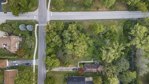 an aerial view of a house with a yard