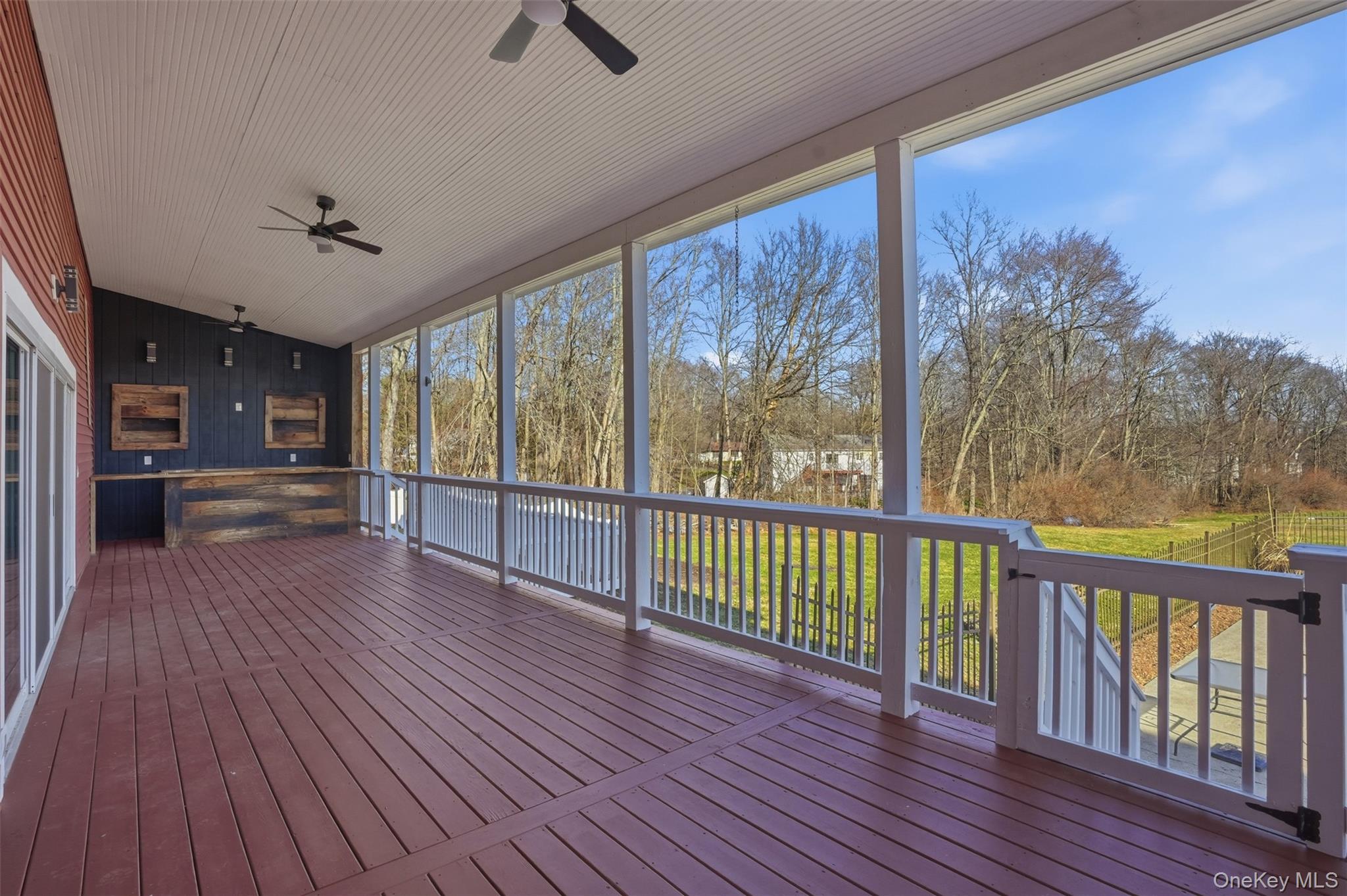 180 Hardenburgh Road Pine Bush, NY 12566 - Photo 2 of 45 Expansive covered back deck with custom built entertainment bar with 100-year-old reclaimed wood from the property.