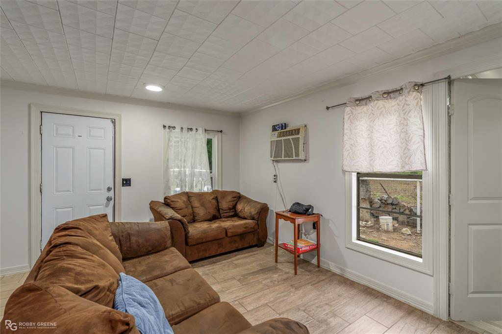 143 New Bethel Booker Road Benton, LA 71006 - Photo 2 of 26 Interior space featuring wood-finish flooring, white walls, and a white paneled ceiling