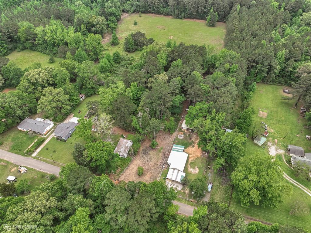 143 New Bethel Booker Road Benton, LA 71006 - Photo 22 of 26 Expansive aerial perspective showcasing a predominantly wooded property with scattered clearings