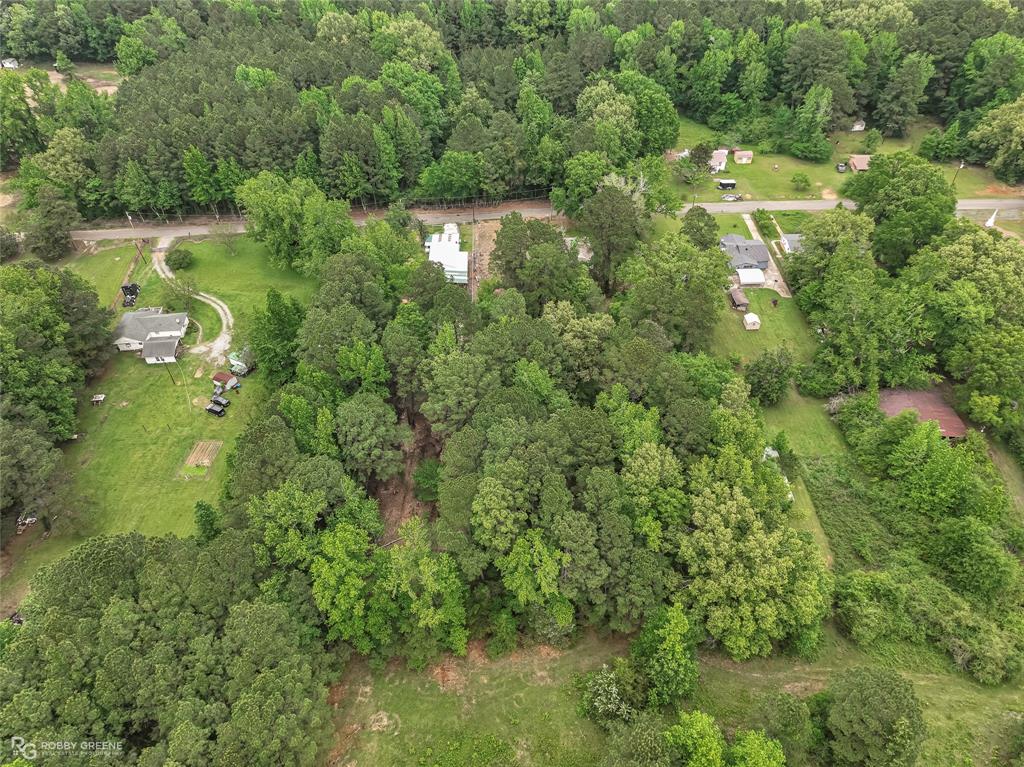 143 New Bethel Booker Road Benton, LA 71006 - Photo 25 of 26 Expansive aerial view of a verdant property, featuring mature trees and a substantial land footprint